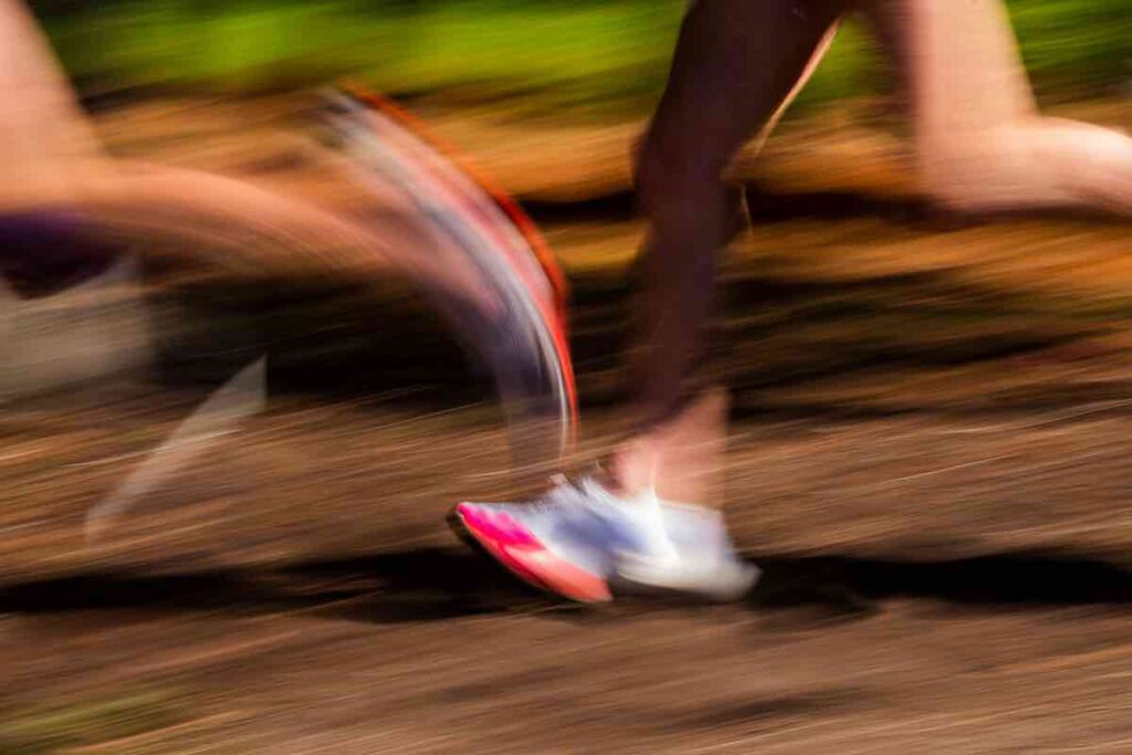 Blurred photos of runners legs at speed