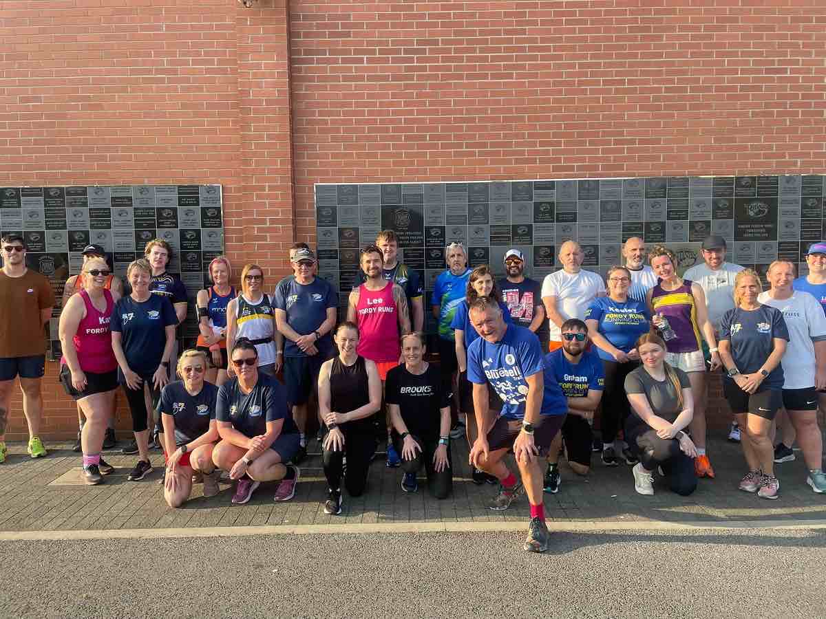 Runners of Leeds Rhinos run club again the South Stand