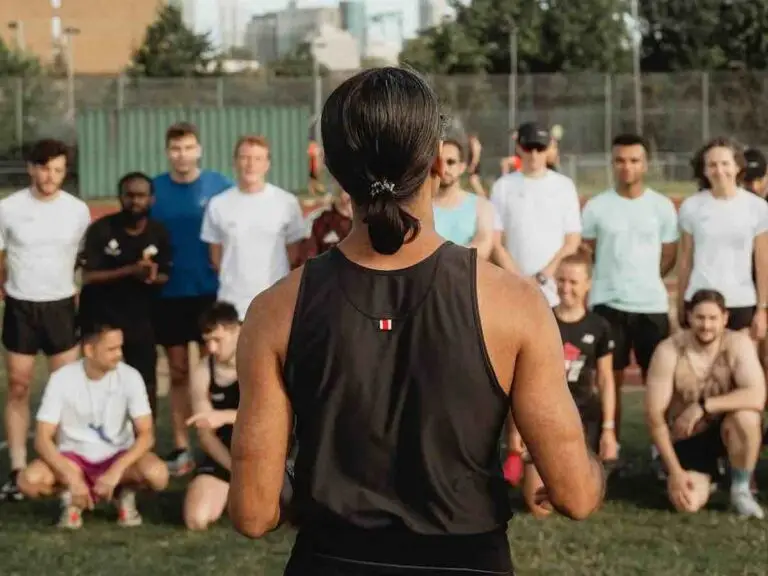 Track East runners briefing on the track